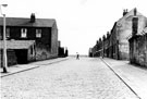 Partly demolished Whitby Road, Darnall looking towards Fisher Lane with Whitby Road County School at the top of the hill on the right