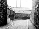 Nos. 1 - 5 Wigan Place, Carbrook looking towards the rear of Nos. 140 - 144 Carbrook Street with Jessop-Saville Ltd., Brightside Works Nos. 1 - 5 Wigan Place, Carbrook looking towards the rear of Nos. 140 - 144 Carbrook Street with Jessop-Saville Ltd., Brightside Works
