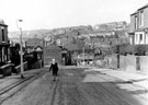 View: s20657 Nos. 26, 24 and Wesley Hall Methodist Church (left) and Nos. 25 and 23, Wincobank Lane looking towards the Ball Inn and Regent Works formerly Picturedome, Upwell Street with Grimesthorpe County school in the background