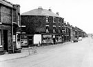 Nos, 152 (extreme left), 150, Clare's Cafe, 146, G. Thorpe, off-license and grocer, 142 etc., Woodbourn Road and the junction with Worthing Road