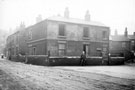Mr. W. A. Lister, draper outside No. 39, Worksop Road with housing on Bootle Street (right) and looking towards Attercliffe Road (left)
