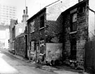 Nos. 5 and 7, Harrow Street (derelict back to back houses, with Nos. 4 and 5 at the rear and Court No. 1). Ecclesall Road and side view of the Earl Grey public house, in background