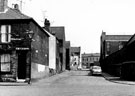 Heppenstall Lane from No. 40, St. Charles Street looking towards Spartan Steel and Alloys Ltd., Spartan Works, Attercliffe Road showing St. Charles School (right) 	