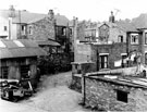 Rear of Nos. 105 - 99 (left) and rear of No. 91 (right), Bolsover Road looking towards Dales corner shop, No. 2 Vickers Road