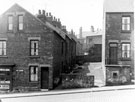 Rear of Nos. 39 - 29 Wood Street (left) and No. 9 Lime Street