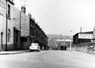 View: s21199 Little London Road from Chesterfield Road, looking towards the railway bridge. Back to back houses, left, leading to Courts Nos 1, 3, 5 and 7. Arnold Laver and Co. Ltd., right