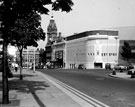Looking towards the Gaumont Cinema, Barker's Pool, junction of Burgess Street. Formerly The Regent. Designed by W.E. Trent. Opened 26th December, 1927. Became the Gaumont in 1946 and was twinned by Rank in 1969 and tripled in 1979. Closed 7th Novembe