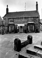 Cross Daggers Inn, No. 14, Market Square, Woodhouse. Woodhouse stocks in foreground Cross Daggers Inn, No. 14, Market Square, Woodhouse. Woodhouse stocks in foreground