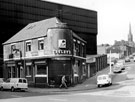 The Corner Pin public house, No. 235 Carlisle Street East at the junction with Lyons Street looking towards All Saints Church with Firth Brown Tools Ltd behind the pub