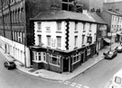 Norfolk Arms public house, No. 26 Dixon Lane, junction of Shude Hill. Old Gas Company Offices, left