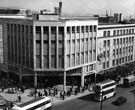 View: s22563 High Street showing Nos. 51 - 57 Peter Robinson Ltd. and (right) Nos. 59 - 65 C and A Modes Ltd., department store