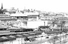 View from Park Hill across Midland Station (note water cooling tower, right), towards City Centre. Granville Street in foreground. Sheaf Valley Baths in foreground. Pond Street Bus Station, Fiesta and Top Rank in background