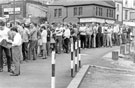 A Queue of striking miners outside a temporary Miners Welfare Centre on Bridge Street 