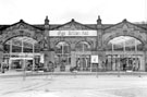 View: s22875 Entrance to Sheffield Midland railway station showing (right) W.H. Smith and Son Ltd. 