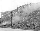Demolition by J. Childs of a stable, Bungay Lane, Park Hill Flats open spaces with Park Hill Flats in the background
