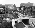 Construction of Furnival Square roundabout and underpass looking towards from Froggatt Lane, properties including the former premises of Oakes, Turner and Co. Ltd., bullion dealers towards Sheffield College of Technology