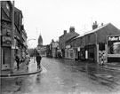 Nos. 30 G. Yospa, jeweller and 31 - 33 Petite Snack Bar; 27 C. Sutcliffe, tobacconist and 23 - 25 Jacob D. Applebaum, booksellers, Division Street from the junction with Carver Street looking towards Barkers Pool