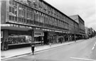 Nos. 102, Sheffield and Ecclesall Co-operative Society Ltd.; 100, Theodore Hamblin Ltd., contact lens centre; 98 Sure Vision; 96 Dolcis Ltd., shoe shop; 94 Etam, ladies fashions etc.,The Moor