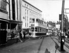 View: s23245 Trams including No. 147 destination Crookes outside C and A Modes Ltd., Nos. 59 - 65 High Street 