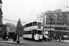 View: s23251 Tram No. 505 at the police controlled pedestrian crossing, High Street with No. 50 Bunker and Pratley Ltd. and No. 48 Wm. Hobson and Sons, tailors in the background