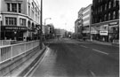 View: s23266 High Street during the one day bus strike on Polling Day showing Nos. 11 - 15 Bradford and Bingley Building Society (left); Nos. 18 Bellman Scotch Wool Shop; 20 Lilly and Skinner Ltd. and 22 Hector Powe Ltd., tailors