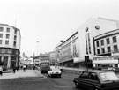 View: s23285 Marples Hotel, No. 4 Fitzalan Square (left) and C and A Modes Ltd., Nos. 59 - 65 High Street looking towards The Hole in the Road, Castle Square from the junction with Fitzalan Square