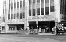 View: s23296 House of Fraser, department store and  the escalators to the Hole in the Road, High Street
