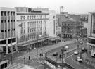 View: s23301 Elevated view of C. and A. Modes Ltd., Nos. 59 - 65 High Street looking towards the junction with Haymarket and the Yorkshire Bank