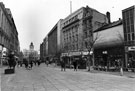 View: s23314 Pedestrianised Fargate looking towards Kemsley House, High Street showing Nos. 41/43, Wallis and Co. Ltd., ladies outfitters 37,Thomas Cook and Son Ltd., tourist agent; 33/35, Woodhouse Furnishers, house furnishers and Marks and Spen