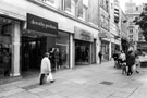Nos. 33 - 35 Top Shop and Dorothy Perkins; 37 Thomas Cook Ltd., travel agent, Fargate looking towards Norfolk Row