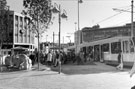 Castle Square Supertram stop during a 'free fare day' to encourage people to use Supertram with the 'Fighting Rams' sculpture by Jonathon Cox left and C and A Modes Ltd. in the background