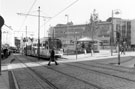 Castle Square Supertram stop during a 'free fare day' to encourage people to use Supertram with GT News kiosk in the background