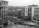 View: s23702 Elevated view of Castle Square and Angel Street showing Thorntons kiosk and Castle House with the Vulcan Sculpture by Boris Tietze, the railings surrounding the Supertram stop are tubular stainless steel railings by Brett Payne