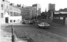 Broad Lane roundabout from Broad Lane and Garden Street (extreme left) junction looking towards (l to r) Tenter Street; Hawley Street and Townhead Street showing Hallamshire Motor Co. Ltd. (left); Pennine Centre; Cathedral Spire and City 