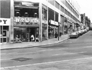 Lotus and Delta Ltd., shoe shop (No. 106 Pinstone Street); Nos. 74, Suede Centre Ltd.; 72, Bargain Beauty; 70, Leicester Temperance Building Society and 66/68; Halifax Building Society, Cambridge Street from Pinstone Street and The Moor