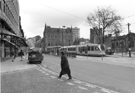 View: s23855 Supertram No. 15 at the Cathedral Supertram stop, Church Street with the Gladstone Buildings and Cathedral in the background