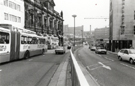 Bendibus; Gas Company Offices (left) and Barclays Bank (right), Commercial Street looking towards Park Square; Hyde Park Flats and Park Hill Flats (left)
