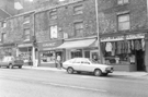 Nos. 64, Davona Jewellers; 62, Conway Tailors; 60, Golf Scene Sports Goods Shop; 58, Goodies Catering; 56, Government Surplus Clothing, retailers and wholesalers, West Street 
