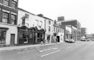 Nos. 94, Saddle Inn; 92, Mitchell and Co., locksmiths, West Street looking towards Co-operative Wholesale Society Ltd. Building (CWS)