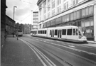 Supertram No. 19 passing Steel City House, West Street 
