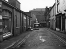 Nos. 2; 4 and 6 Orchard Place looking towards No. 8 Sheffield Corporation Maternity and Child Welfare Association; J.N.Di Nitto, watchmaker and the rear of The Stonehouse public house, 21 Church Street with No.15 Sunshine Foods Ltd, Orchard Street le