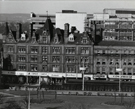 Nos. 62 A. Jones and Son Ltd., shoe shop; 60 K Shoe Shop; 52 Suedecraft, leather outwear; 48/50 Moss Bross, outfitters; 46 Ansells Opticians Ltd.; 42 L. Stonefield Ltd., jewellers and F. Coleridge, Pinstone Street and the Peace Gardens 