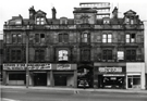 Derelict Nos. 127-131, former premises of H.H. Sugg Ltd., sports outfitters; 135 former premises of Barney Goodman Ltd., tailor and 137, Pinstone Street showing Cambridge Arcade in the centre leading to Union Street