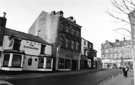 View: s24190 Nos. 12/14, The Hornblower public house (formerly The Raven public house) 8/10, Neville Watts of Sheffield, architectural and builders ironmongery;  6, David W. Shepherd, opthalmic optician and 4, Artisan, yarns, Fitzwilliam Street 