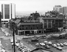Elevated view from Central Library, Nos. 18 J. Leach, grocers; 16, J.B. Adam Ltd., outfitters; Andreas, gents hairdressers; 12, The Paper Shop and Revenue Chambers, Howard Street showing Norfolk Lane AEUW offices and Grosvenor House Hotel back