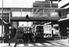 View: s24263 Cleaning the windows on Pond Street footbridge with (left) Pond Street bus station 