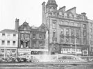 View: s24460 Goodwin Fountain, Fargate and Nos. 70 - 62; H.L Brown and Son Ltd., jeweller; Cantors Ltd., house furnishers; Royal London Mutual Insurance Soc. Ltd;  Dean and Dawson Ltd., travel agents; Legal and General Assurance Soc. Ltd.