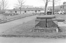 Base of the memorial to Robert Ernest MD (1771-1841), St. Philip's Churchyard, Infirmary Road looking towards Ashton Alarms; Sunseeker, Penistone Road and The Wellington public house (later became the Cask and Cutler), No. 1 Henry Street