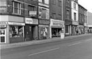 Nos. 599 - 613 Arena Sports; derelict DER Ltd, tele rental; derelict Vickers; Modtex; former premises of G. Oliver and Sons, butchers and Shenton, Attercliffe Road looking towards the junction of Shortridge Street