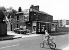 Nos. 92 F. Osbourne, newsagents and 90 Jack Archer, athletic outfitter, Bramall Lane at the junction with Ascot Street, F.E.Hall Co. Ltd., motor repairers in the background